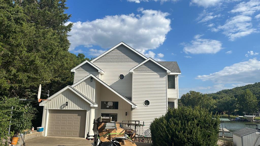 Exterior siding and trim work on lakefront home, NJ