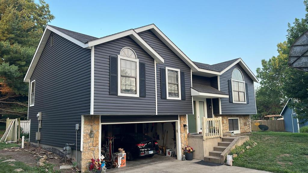Dark blue siding installation on residential home, South Jersey