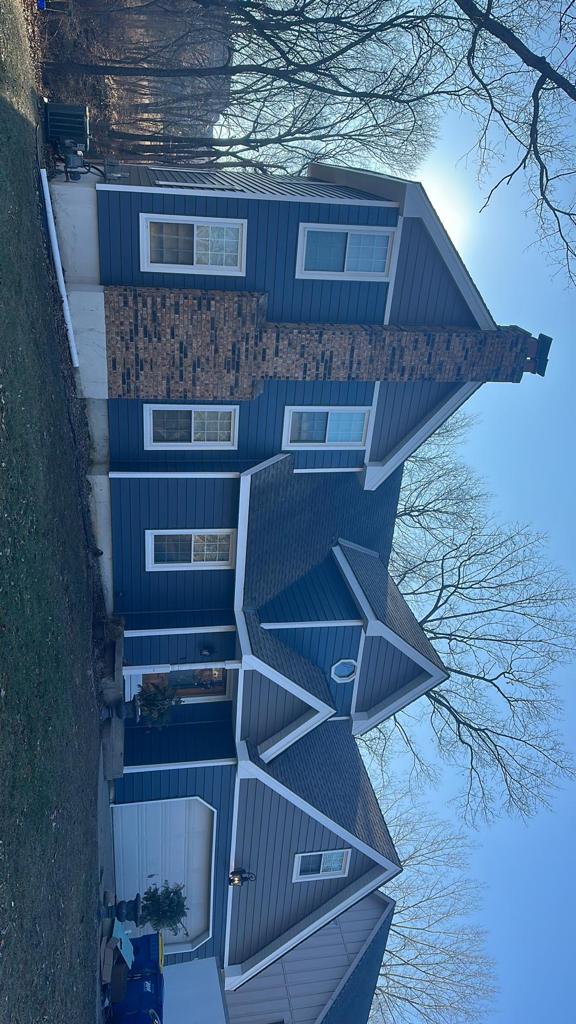 Board and batten siding with brick accent, South Jersey